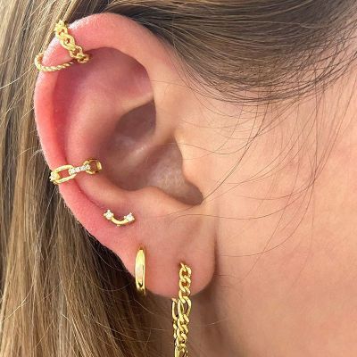 piercing de oreja dorado